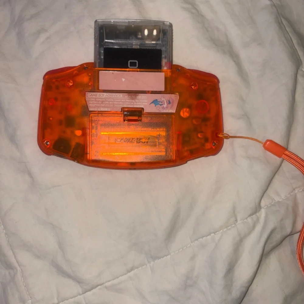 Nintendo Game Boy Advance in Translucent Orange with Purple Case